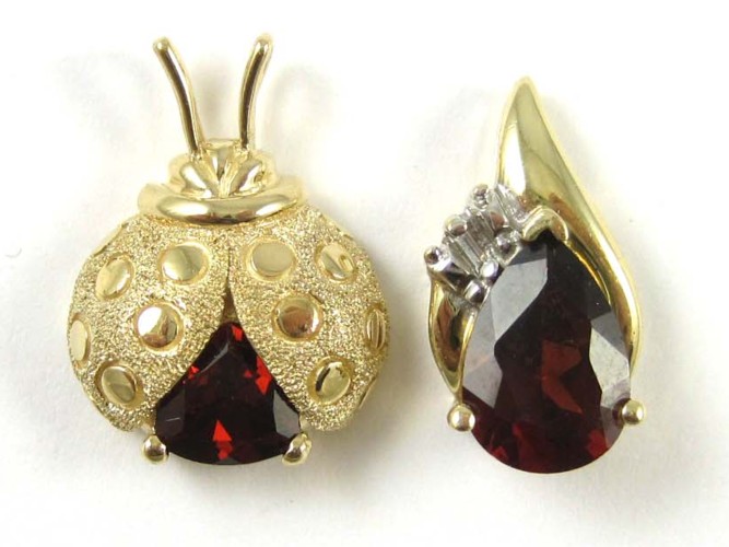 TWO GARNET AND FOURTEEN KARAT GOLD 16f953