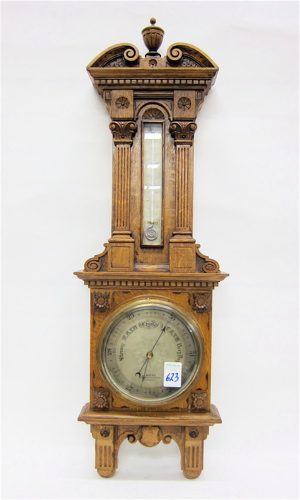 AN OAK CASED WALL BAROMETER/THERMOMETER