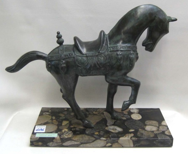 A CHINESE BRONZE TANG STYLE HORSE