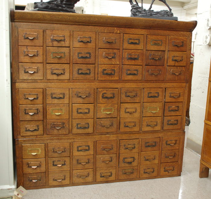 A SIXTY-THREE DRAWER OAK CARD FILE