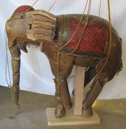 A PAKISTANI CARVED WOOD ELEPHANT 16fc4e