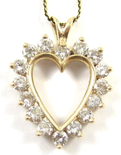 DIAMOND AND FOURTEEN KARAT GOLD PENDANT