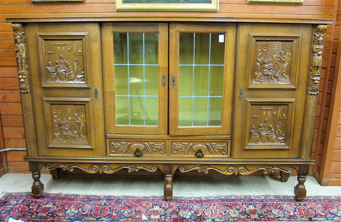 LARGE FOUR-DOOR CARVED OAK CABINET