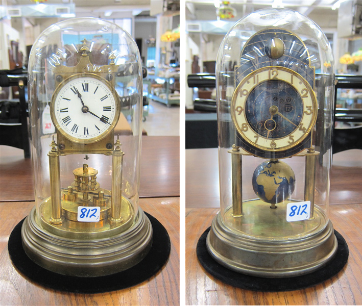 TWO GERMAN GLASS DOMED ANNIVERSARY CLOCKS: