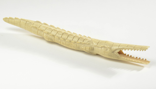 AN AFRICAN HAND CARVED IVORY CROCODILE