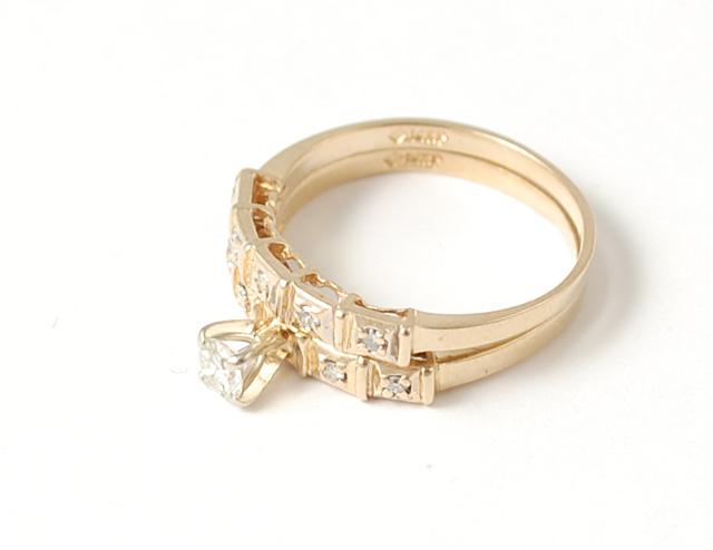 DIAMOND AND FOURTEEN KARAT GOLD WEDDING