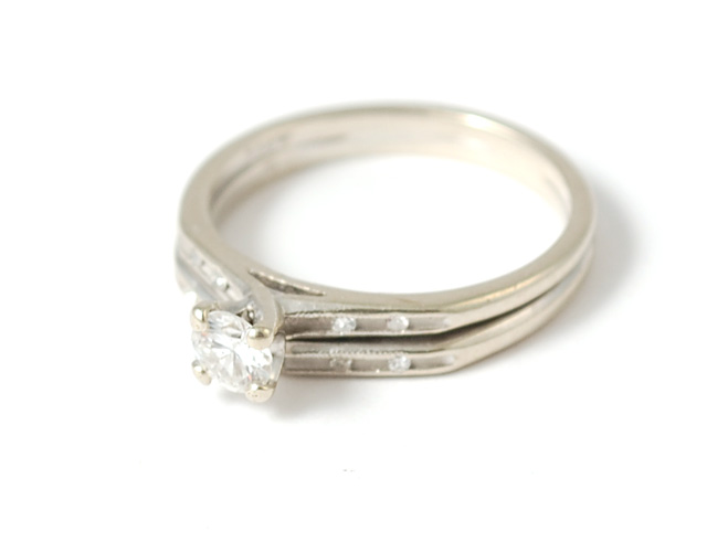 DIAMOND AND FOURTEEN KARAT WHITE GOLD