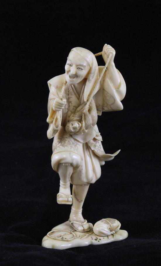 A Japanese ivory figure of a monkey