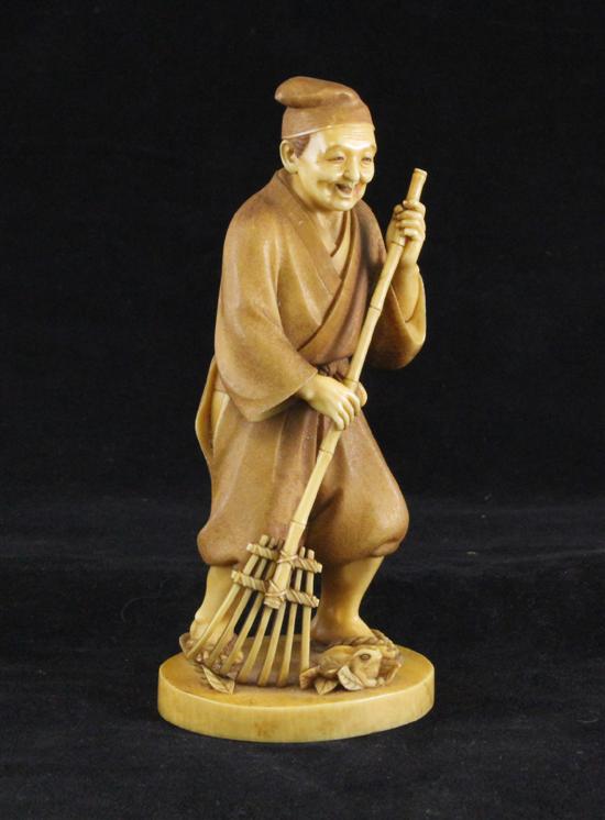A Japanese stained ivory figure