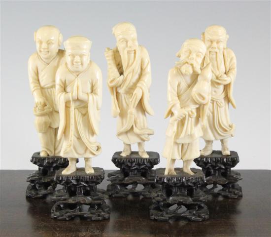 A set of eight Chinese ivory figures