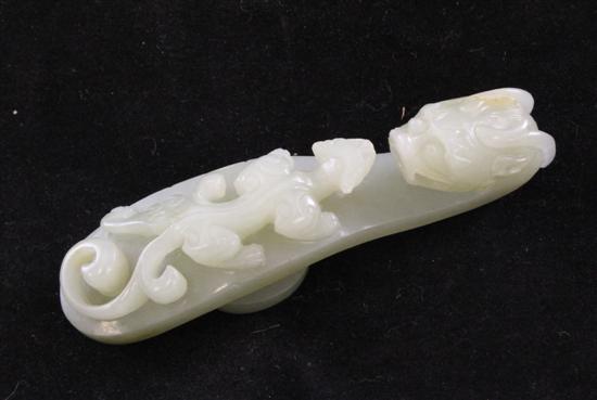 A Chinese celadon jade belt hook