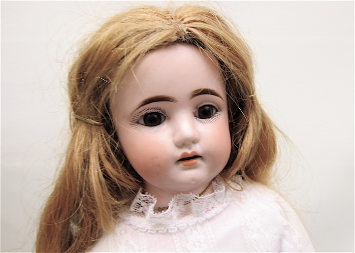 GERMAN BISQUE HEAD GIRL DOLL AND