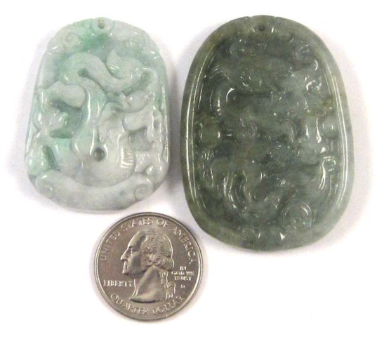 TWO CARVED GREEN JADE PENDANTS 16e428