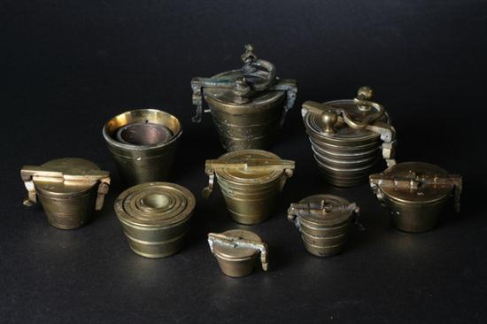 SEVEN BRASS NESTING WEIGHTS. 18th-19th