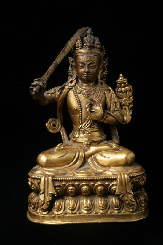 TIBETO-CHINESE GILT BRONZE FIGURE