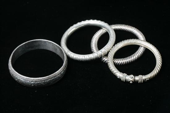 FOUR CHINESE SILVER BANGLES. -