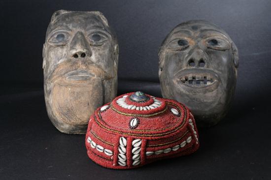 TWO AFRICAN MASKS. Together with one