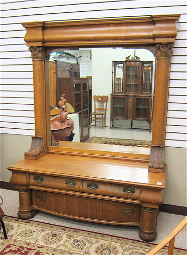 AN UNUSUAL OAK LOW DRESSER WITH