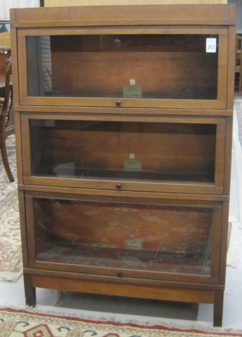 A STACKING WALNUT BOOKCASE The