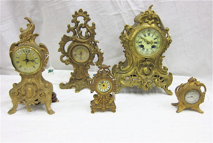 FIVE SMALL CAST METAL TABLE CLOCKS: