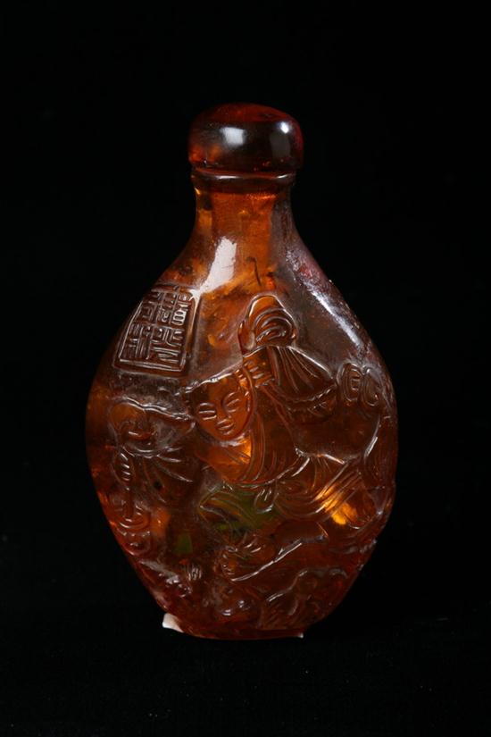 CHINESE AMBER SNUFF BOTTLE. Flattened