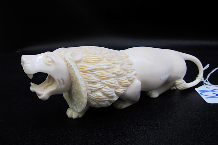 AFRICAN CARVED IVORY LION: a full