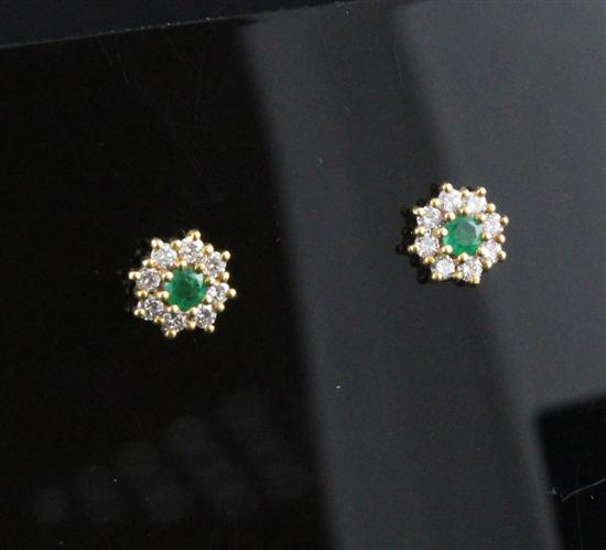 A pair of 18ct gold emerald and