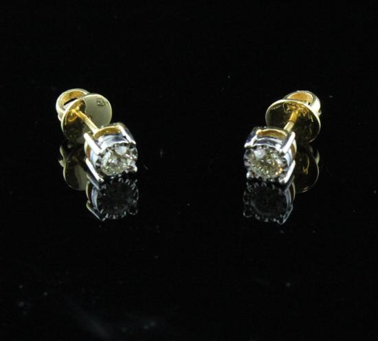 A pair of 18ct gold solitaire diamond