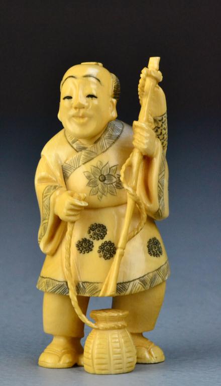 Japanese Carved Ivory Okimono Of A FishermanFinely