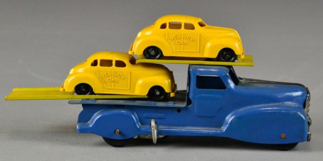 A Yellow Cab Carrier ToyA wind up blue