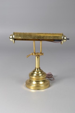 An Adjustable Brass Bankers LampOn