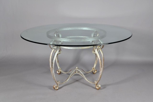 A Beveled Glass and Iron Dining TableWrought