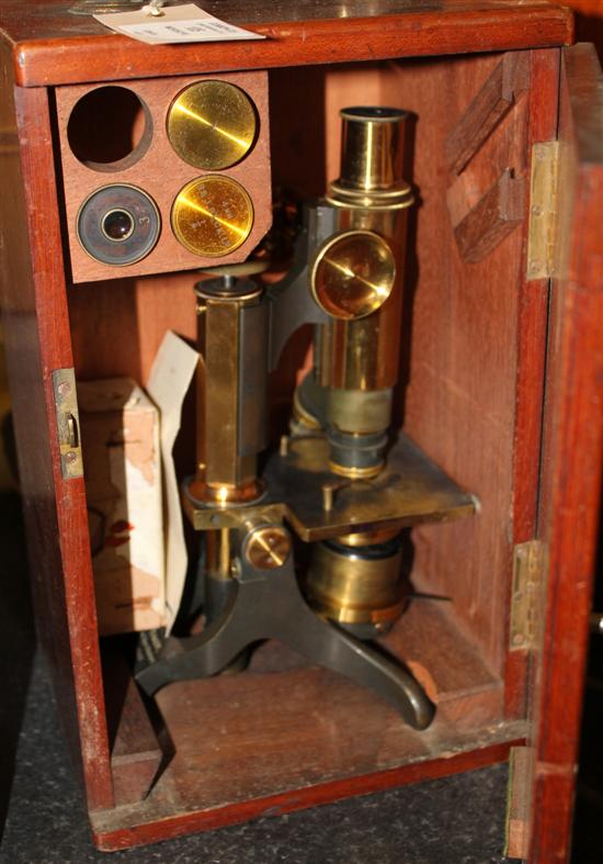 A 19th century lacquered brass microscope