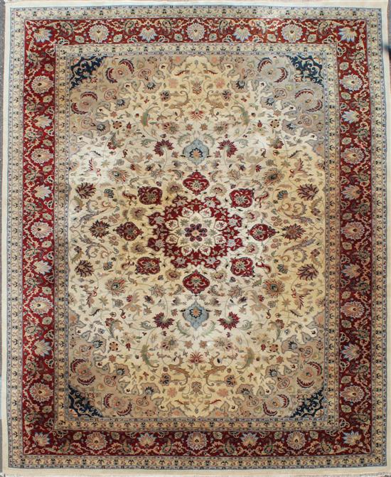 An Oriental Kashan design carpet