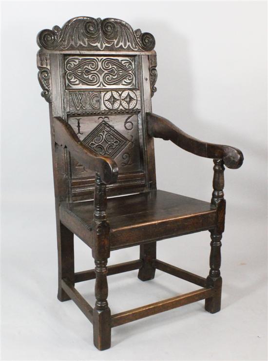 A Charles I oak panel back armchair