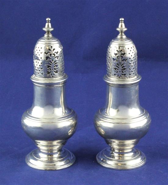 A pair of George II silver sugar