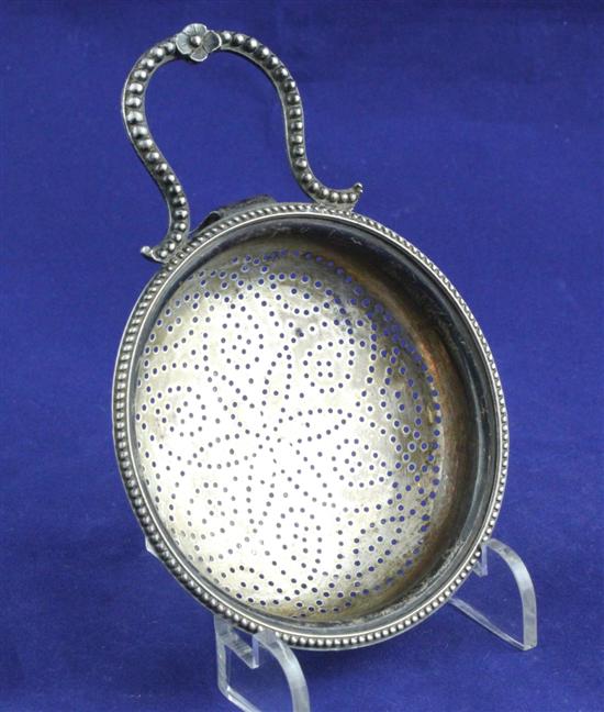 A George III silver lemon strainer