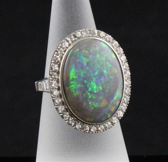 An 18ct white gold black opal and 172eed