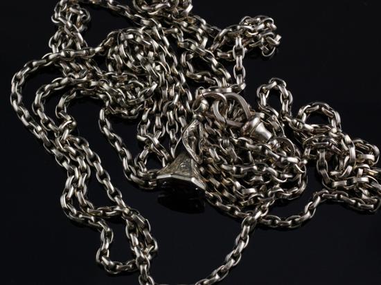 A 9ct gold guard chain with fob