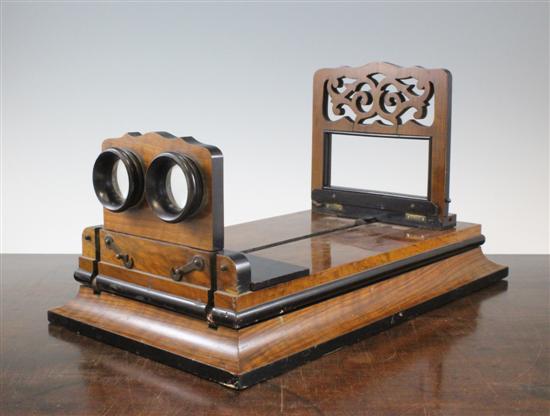 A Victorian walnut adjustable stereoscopic