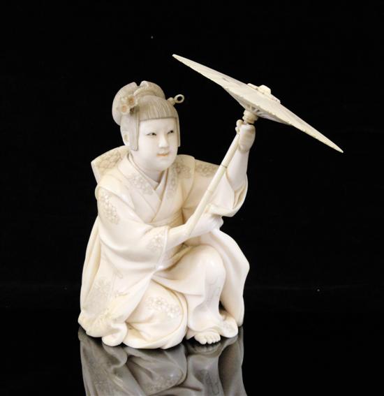 A Japanese ivory figure of a seated 1730db