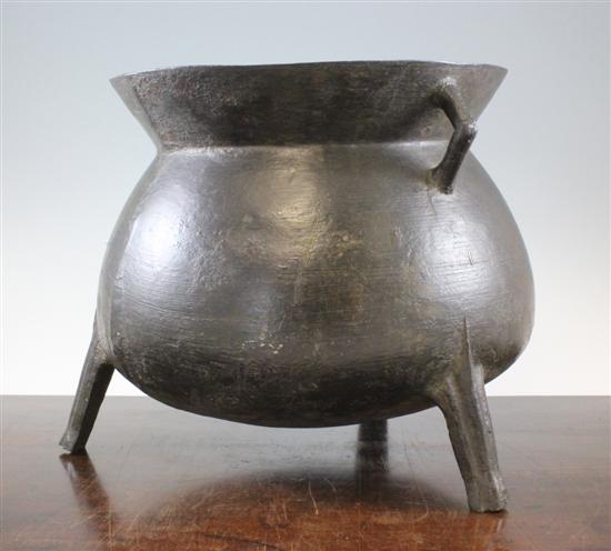A bronze three legged cauldron