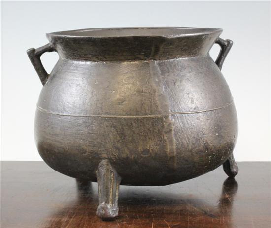 A bronze double handled cauldron
