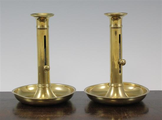 A pair of brass chamber candlesticks