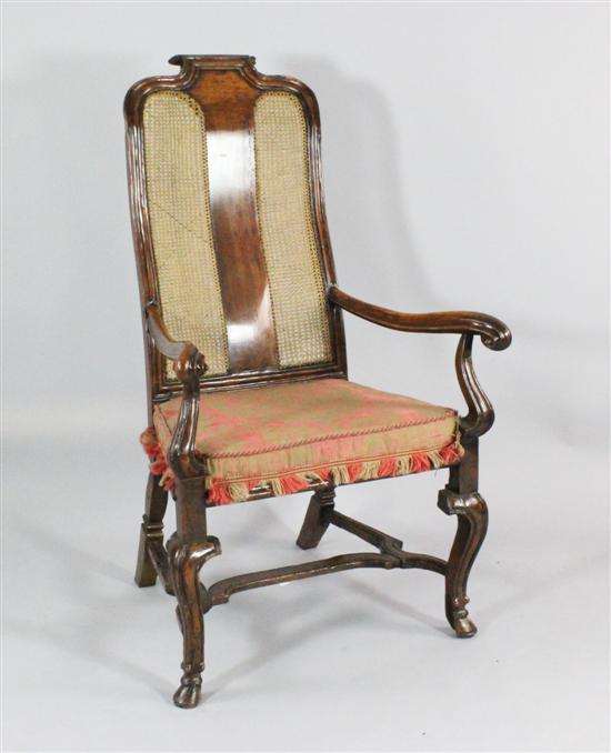 A Queen Anne walnut and cane armchair 173179