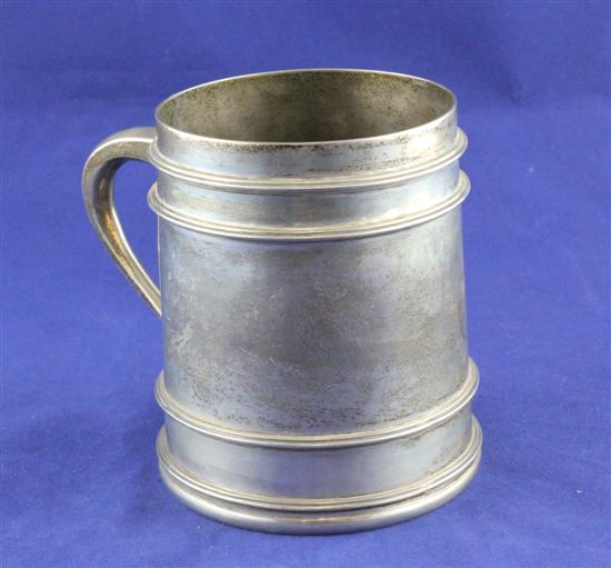 An Edwardian silver mug of restrained