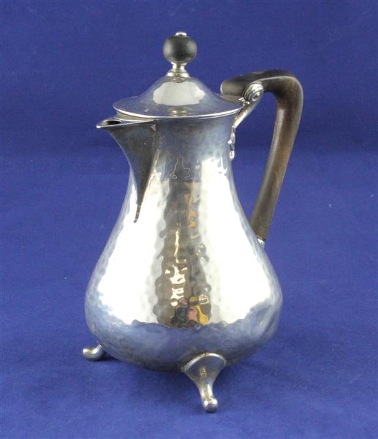 An Edwardian silver hot water jug