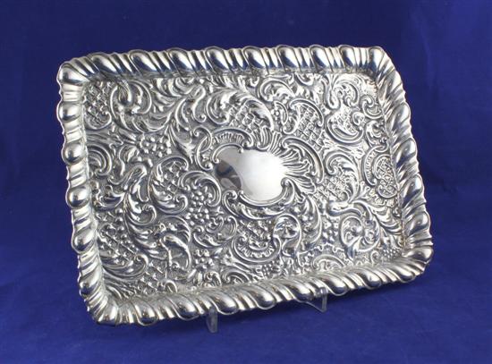 An Edwardian repousse silver dressing