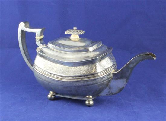 A George III silver teapot of rounded 170b3e