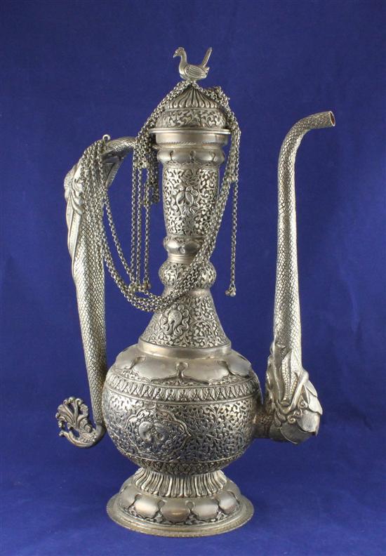 An Indian white metal ewer and cover